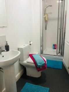 A clean and well-maintained bathroom featuring ...