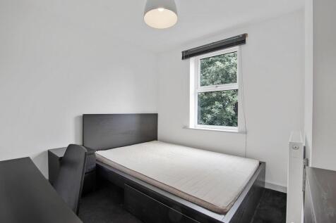 Bright and neat single bedroom featuring a comf...