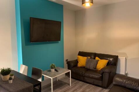 A modern and cozy living room featuring two dar...