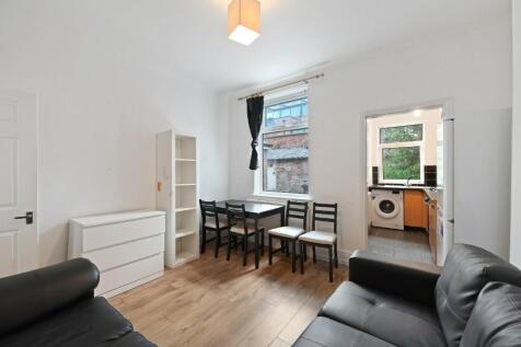 Bright and tidy living room with natural light ...