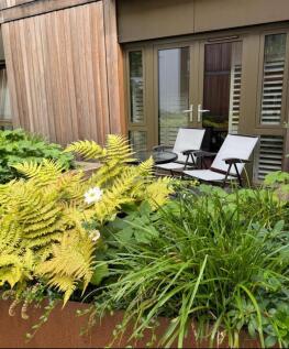 A peaceful and well-maintained garden area feat...