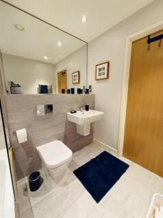 A modern and spotless single toilet with sleek ...