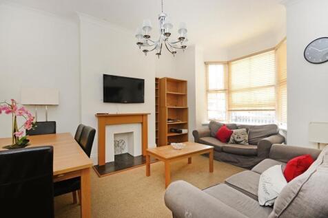 Bright and inviting living room featuring comfo...