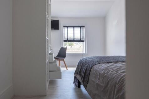A stylish and inviting double bedroom featuring...