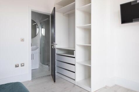 A beautifully designed double bedroom featuring...