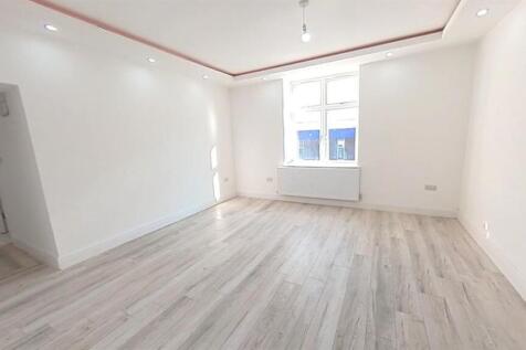 A bright and spacious master bedroom featuring ...