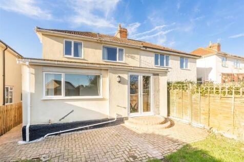 Bright and inviting exterior of a semi-detached...