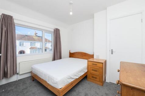 Bright and tidy double bedroom featuring a larg...