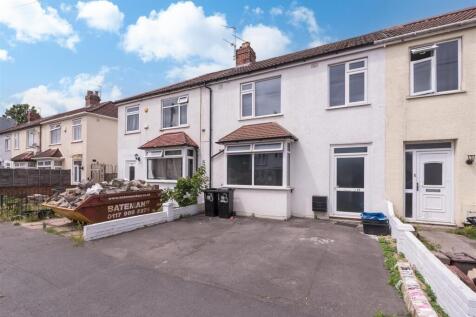 A well-maintained terraced house with a clean d...