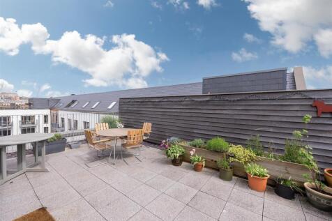 Spacious rooftop garden terrace with ample natu...