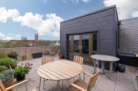 Spacious rooftop garden terrace featuring outdo...