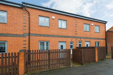 Charming exterior view of a stylish brick prope...