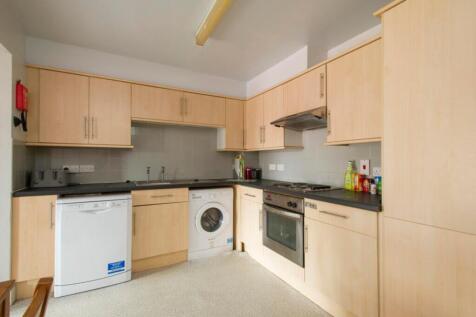 A modern, well-equipped kitchen featuring ample...