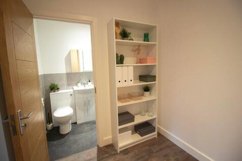 A modern bathroom featuring sleek fixtures, amp...