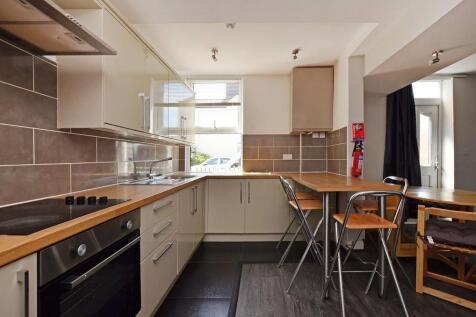 Bright and modern kitchen featuring ample count...