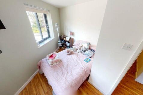 Bright and cozy double bedroom featuring a comf...