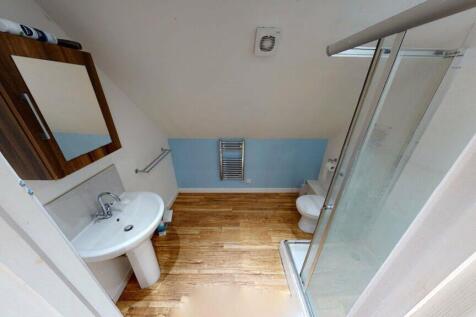 A clean and bright bathroom featuring a modern ...