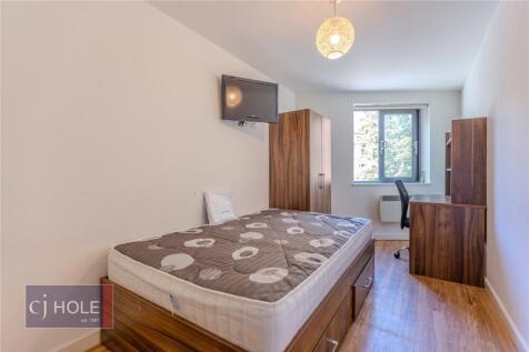 Bright and tidy single bedroom featuring a doub...