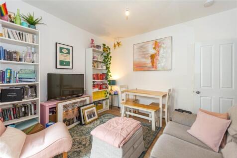 Bright and cozy living room featuring comfortab...