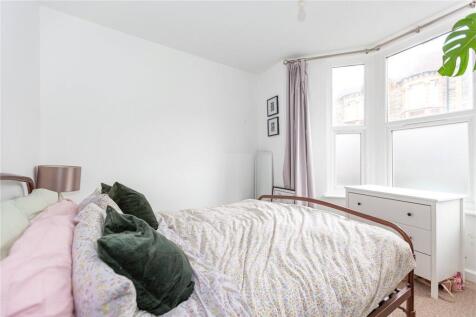 Bright and cozy double bedroom featuring a comf...