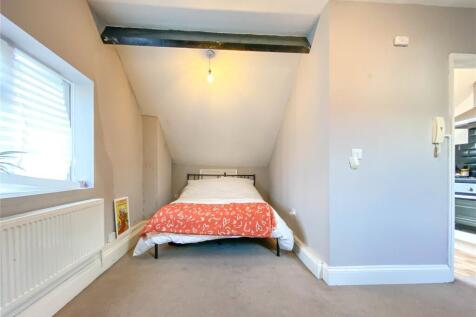 A cozy double bedroom featuring a comfortable d...