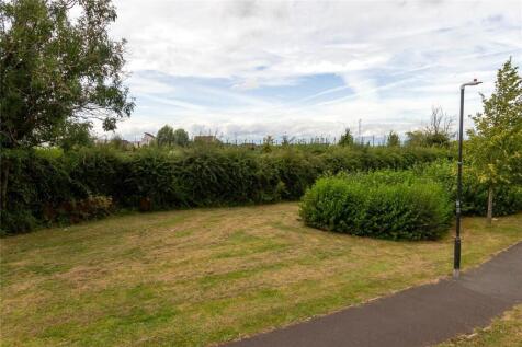 A well-maintained garden area featuring neatly ...