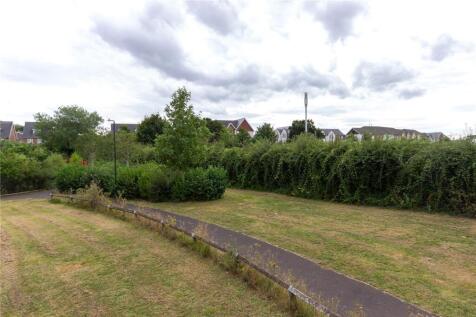 A well-maintained garden area featuring a neatl...