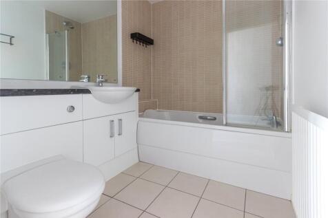 Bright and clean bathroom featuring a modern wh...