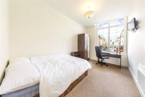 Bright and cozy double bedroom featuring a larg...