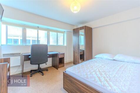 Bright and tidy double bedroom featuring a larg...