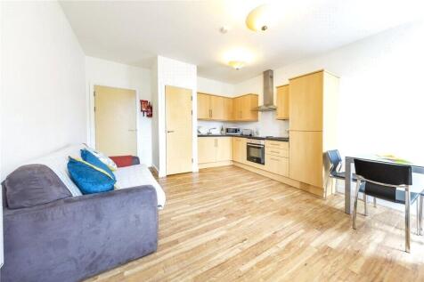 Bright and modern living space featuring a slee...