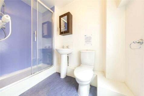 Bright and clean bathroom featuring a modern sh...