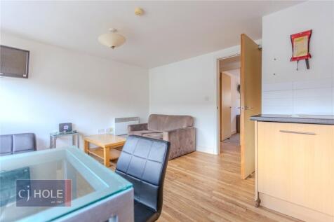 Bright and welcoming living room featuring mode...