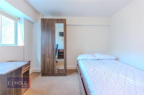 A neat and bright single bedroom featuring a co...