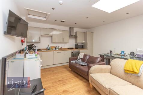 A modern, well-maintained living room featuring...