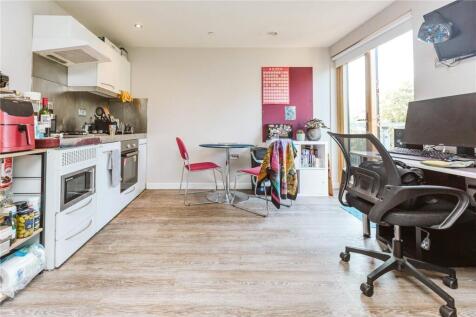 Bright and modern kitchen area featuring ample ...