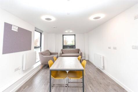 Bright and modern communal workspace featuring ...