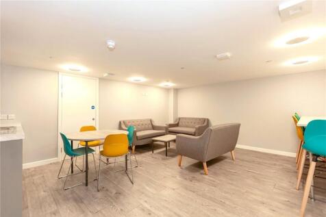 A modern communal lounge featuring comfortable ...