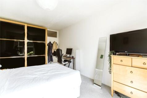 Bright and spacious master bedroom featuring a ...