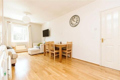 Bright and inviting living room featuring natur...