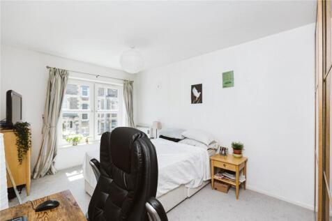 Bright and tidy double bedroom featuring a comf...