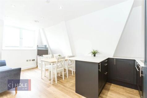 Bright and modern living space featuring a spac...