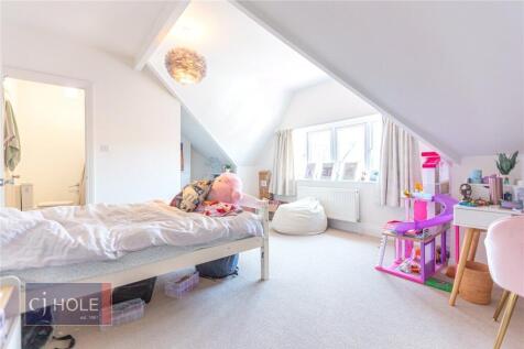 Bright and inviting spacious bedroom with a lar...