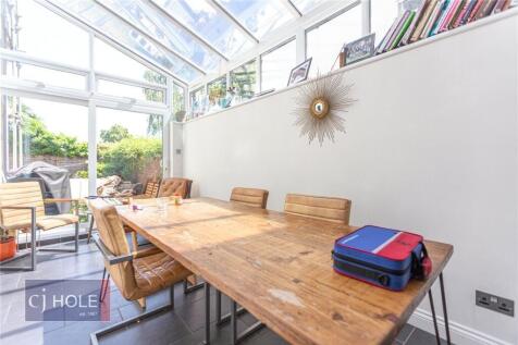 Bright and airy dining and living space with a ...