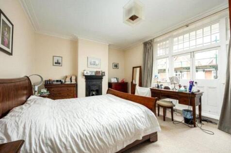 Spacious and warmly furnished master bedroom fe...