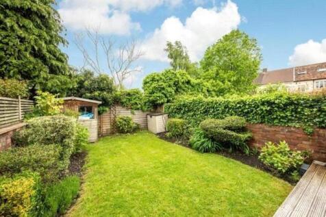 A beautifully maintained garden featuring a lus...