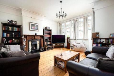 A spacious and inviting living room featuring l...