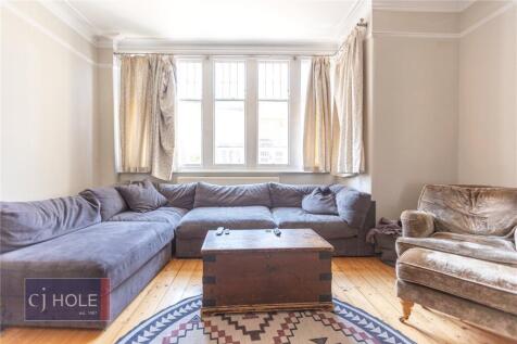 Bright and inviting living room featuring a lar...