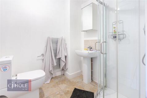 Bright and modern bathroom featuring a spacious...