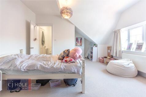 Bright and cozy bedroom with a comfortable sing...